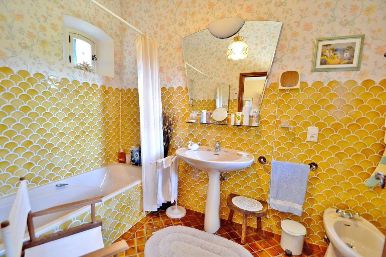 Nestling in nearly an acre of glorious landscaped gardens with pool, is thi