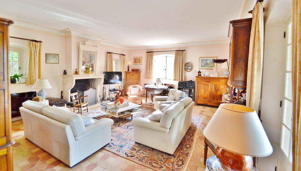 Nestling in nearly an acre of glorious landscaped gardens with pool, is thi