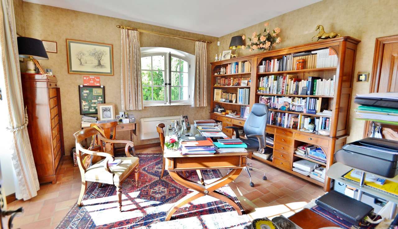 Nestling in nearly an acre of glorious landscaped gardens with pool, is thi