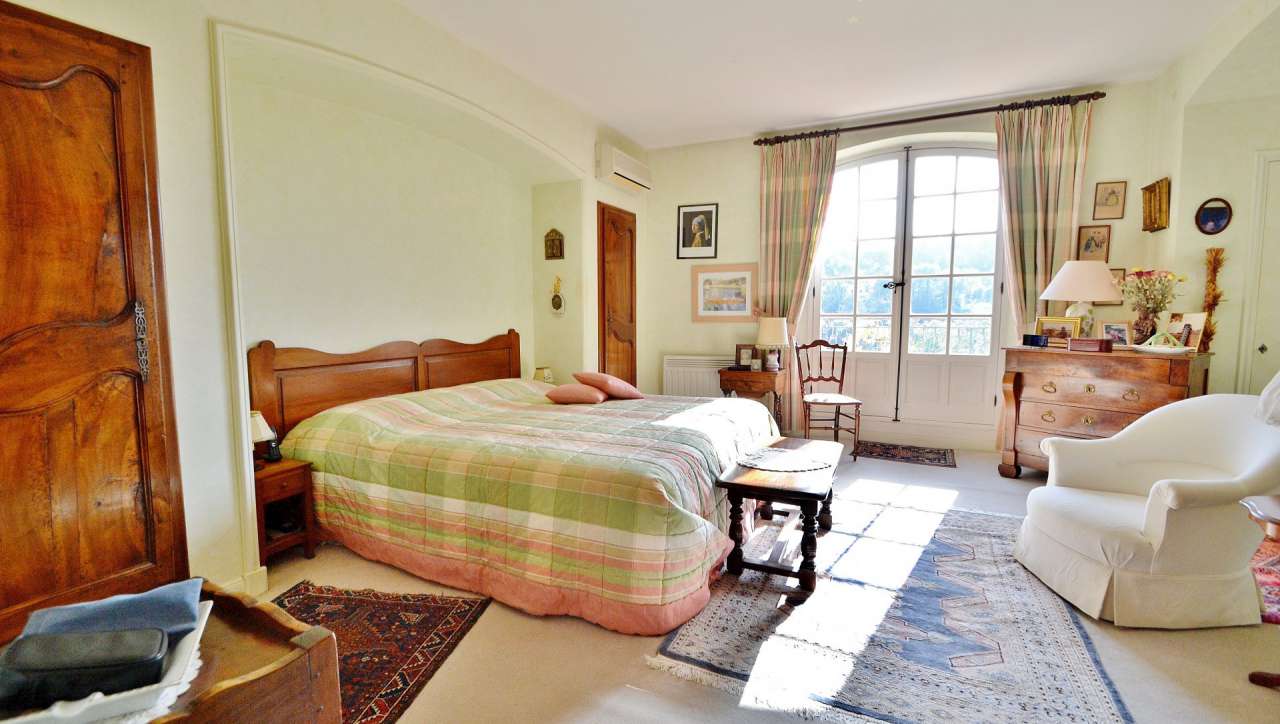 Nestling in nearly an acre of glorious landscaped gardens with pool, is thi