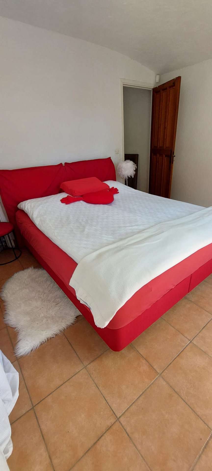 Nestling in beautiful landscaped gardens with pool, is this stylishly renov