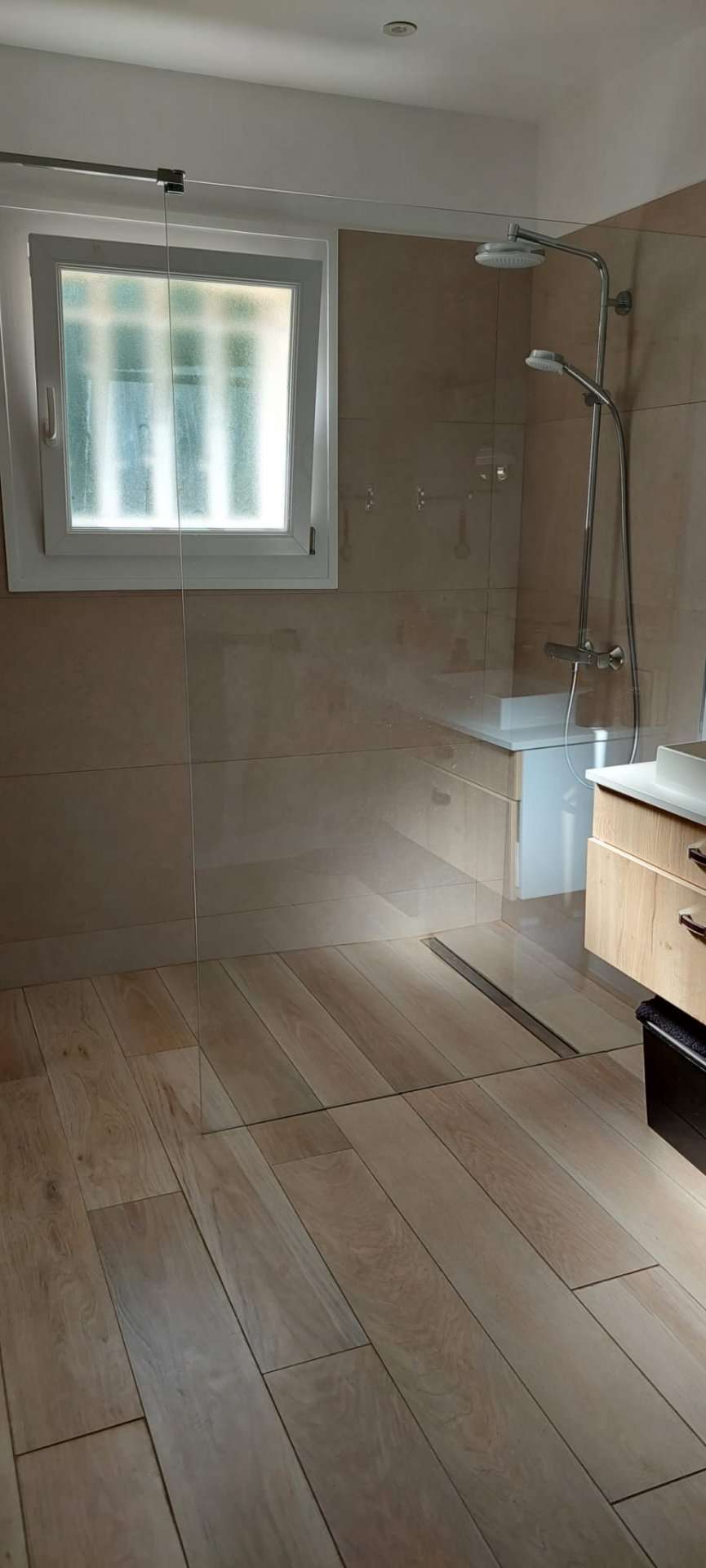 Nestling in beautiful landscaped gardens with pool, is this stylishly renov