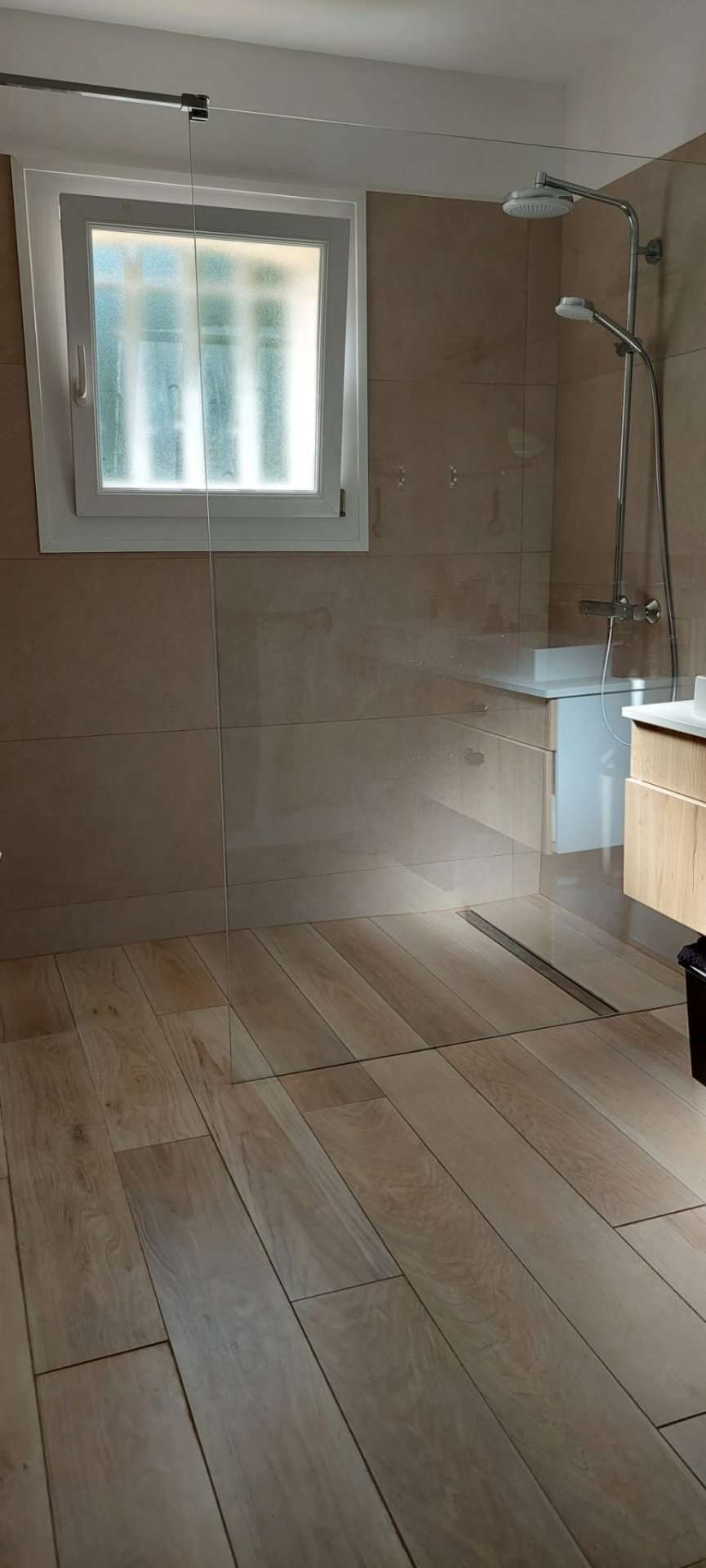 Nestling in beautiful landscaped gardens with pool, is this stylishly renov