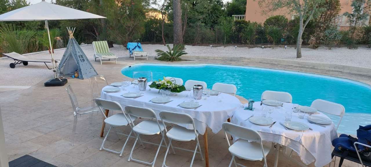 Nestling in beautiful landscaped gardens with pool, is this stylishly renov