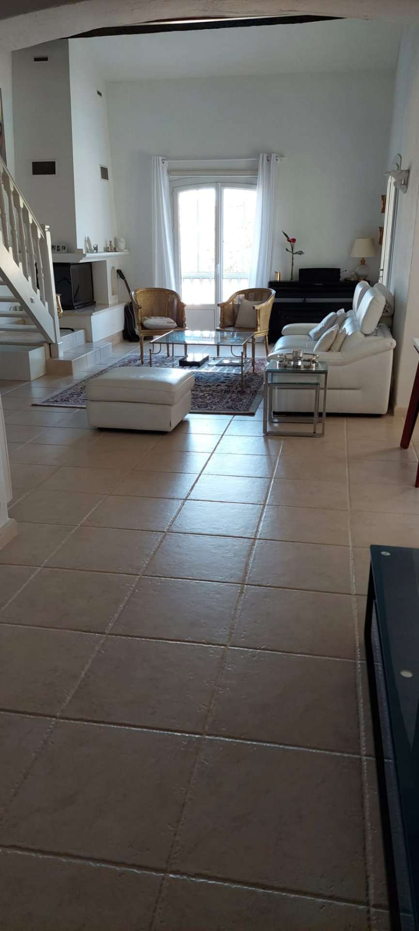 Nestling in beautiful landscaped gardens with pool, is this stylishly renov