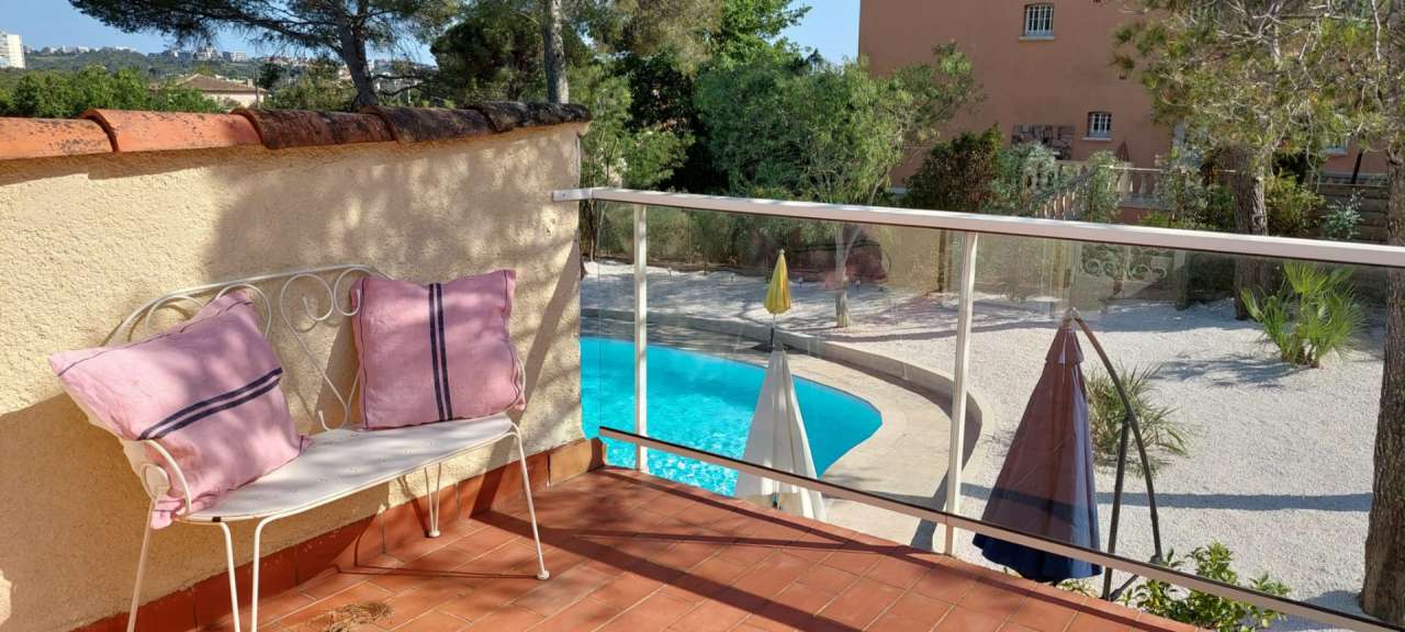 Nestling in beautiful landscaped gardens with pool, is this stylishly renov