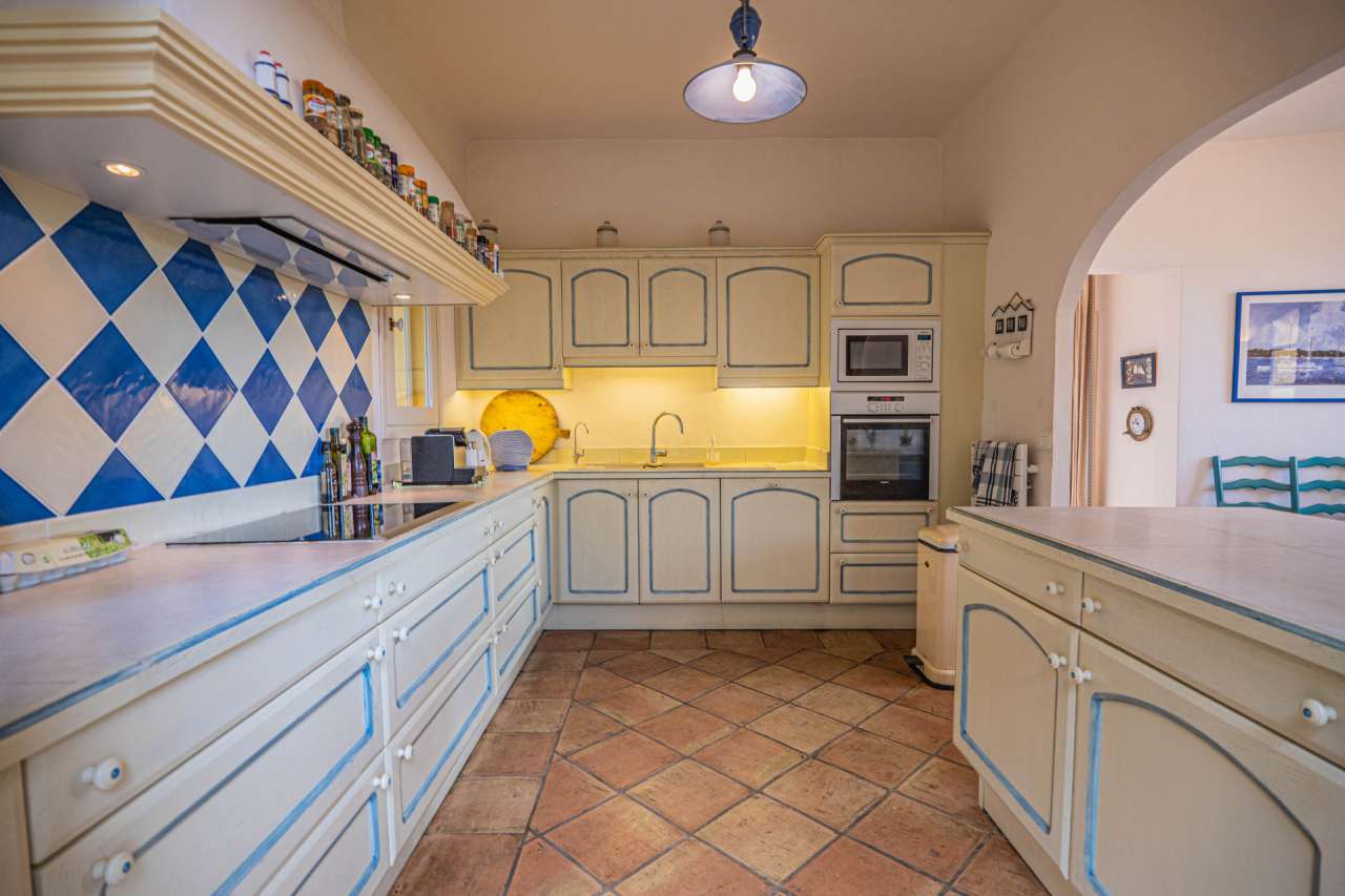 Nestling in beautiful landscaped gardens with expansive pool, is this outst