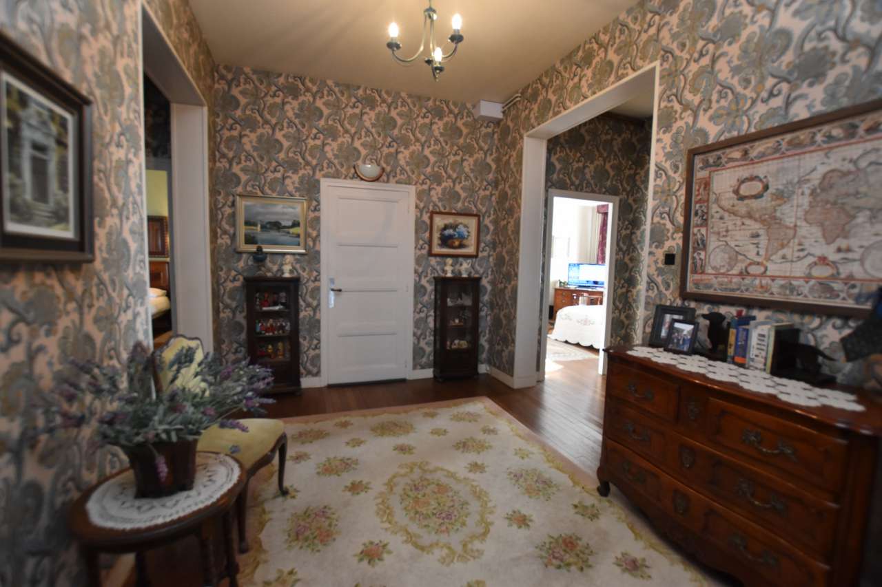 Tastefully renovated 3 storey, 8 bedroom house with beautiful enclosed gard