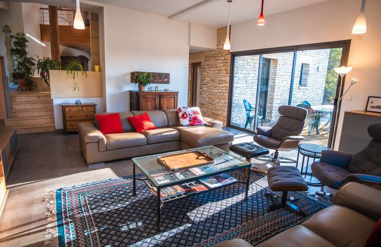 Nestling in over an acre of mature landscaped gardens, is this unique archi