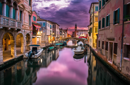 Canal by luxury properties in Venice.