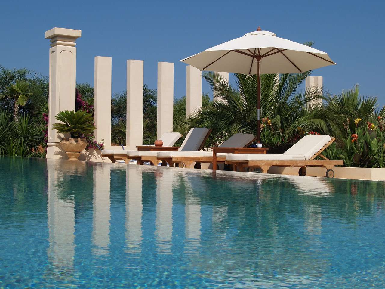 Luxury mansion for sale with sea views across the bay of Cala Jondal beach. Yoga retreats ibiza