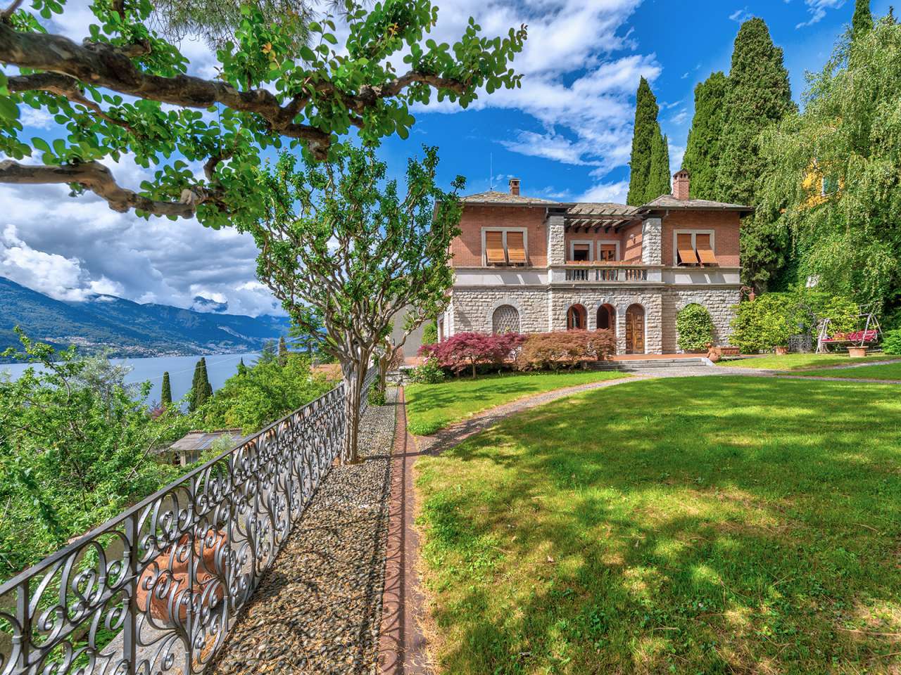Waterfront villa with pool for sale on Lake Como, and boathouse, nestling in beautiful landscaped gardens.